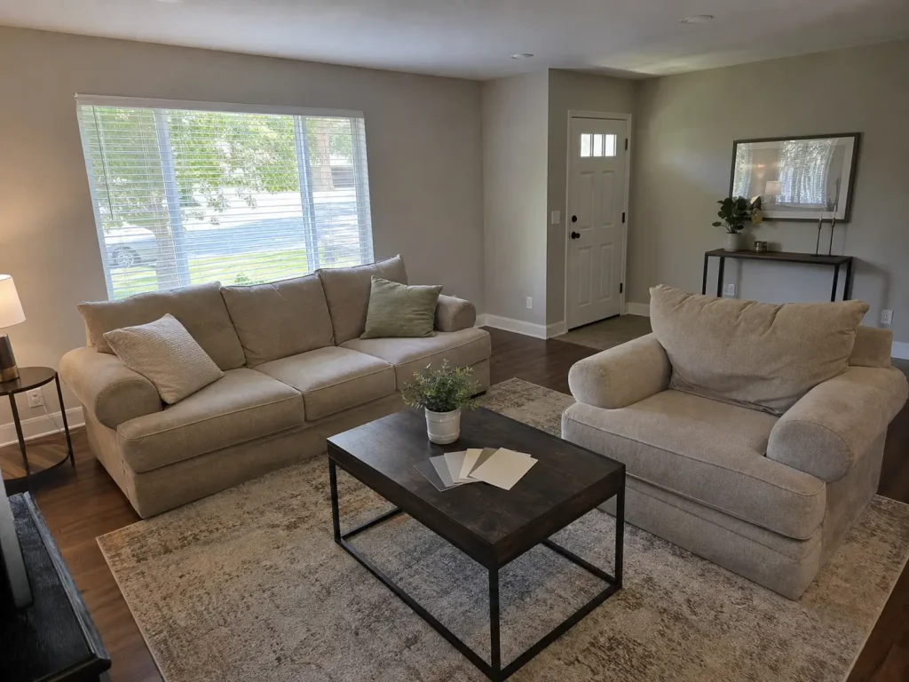 Neutral staged living room with paint samples showing colors buyers respond to
